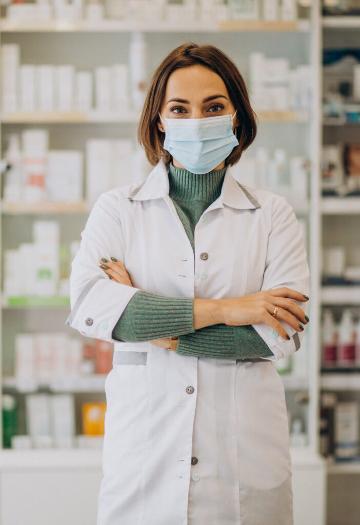 Young woman pharmacist at pharmacy
